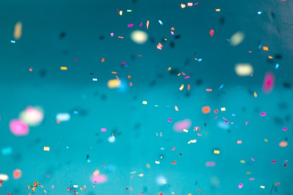 Confetti scattering on a blue background